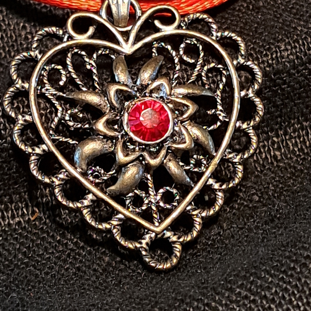 Elegant Silver Heart Pendant with Red Gemstone